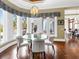 Charming breakfast nook featuring a glass table and views of the pool at 5132 Jungle Plum Rd, Sarasota, FL 34242