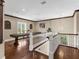 Spacious game room featuring a billiard table, hardwood floors, and lots of natural light at 5132 Jungle Plum Rd, Sarasota, FL 34242
