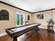 Game room with a shuffleboard table, perfect for entertaining guests and Gathering at 5132 Jungle Plum Rd, Sarasota, FL 34242