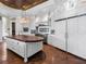 Bright kitchen with a butcher block island, stainless steel appliances, custom cabinetry and view of dining area at 5132 Jungle Plum Rd, Sarasota, FL 34242