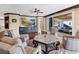 Comfortable living room with hardwood floors, stylish furnishings, and outdoor access at 5132 Jungle Plum Rd, Sarasota, FL 34242