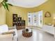 Comfortable living room with decorative accessories and lots of natural light with views of the outdoor pool at 5132 Jungle Plum Rd, Sarasota, FL 34242