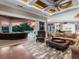 Elegant living room with seamless transition to the outdoor pool and patio area at 5132 Jungle Plum Rd, Sarasota, FL 34242
