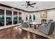 Cozy living room with hardwood floors and a seamless transition to the outdoor patio at 5132 Jungle Plum Rd, Sarasota, FL 34242