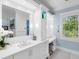Bright bathroom featuring a modern vanity, a makeup table, and plenty of storage at 5132 Jungle Plum Rd, Sarasota, FL 34242
