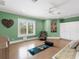 Zen yoga room with lots of natural light, cork flooring and calming colors for exercise and wellness at 5132 Jungle Plum Rd, Sarasota, FL 34242