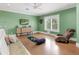 Zen yoga room with lots of natural light, cork flooring and calming colors for exercise and wellness at 5132 Jungle Plum Rd, Sarasota, FL 34242