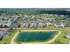 Beautiful aerial view of home overlooking the pond in a well-maintained community at 5320 Tide Point Way, Bradenton, FL 34208