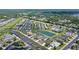 Aerial view of the property surrounded by a Gathering-friendly community, ponds, and meticulously manicured landscaping at 5320 Tide Point Way, Bradenton, FL 34208