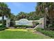 A community sign for the gated community of River Sound with lush landscaping and palm trees at 5320 Tide Point Way, Bradenton, FL 34208