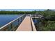 Community dock overlooking calm waters and lush greenery, ideal for relaxing and enjoying the natural surroundings at 5320 Tide Point Way, Bradenton, FL 34208