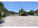 Elegant gated entrance with lush landscaping and brick-paved driveway at 5320 Tide Point Way, Bradenton, FL 34208