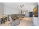 Open-concept living area with tile floors, modern decor, and a view leading into the dining and kitchen area at 5320 Tide Point Way, Bradenton, FL 34208