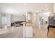 Bright, open-concept living space featuring tile flooring, modern furnishings, and seamless flow to kitchen at 5320 Tide Point Way, Bradenton, FL 34208