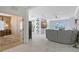 Bright and airy living room with white tile floors seamlessly connects to other living spaces in this open concept layout at 5320 Tide Point Way, Bradenton, FL 34208