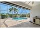 Enjoy this inviting screened-in pool with a waterfall feature, lush landscaping, and lake views at 5320 Tide Point Way, Bradenton, FL 34208