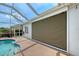 The screened-in pool features lights and an automatic privacy shade is located just off the patio at 5320 Tide Point Way, Bradenton, FL 34208