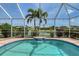 Enjoy this screened-in pool with a waterfall feature, lush landscaping, and lake views at 5320 Tide Point Way, Bradenton, FL 34208