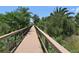 Picturesque community walkway lined with lush greenery and trees, providing a serene outdoor experience at 5320 Tide Point Way, Bradenton, FL 34208