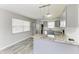 Kitchen features grey cabinets, stainless appliances, and granite countertops at 5710 16Th W St, Bradenton, FL 34207