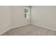 Cozy bedroom with plush carpeting and a window offering natural light at 5985 Amberly Dr, Bradenton, FL 34208