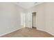 Inviting bedroom with soft carpeting and easy access to a walk-in closet at 5985 Amberly Dr, Bradenton, FL 34208