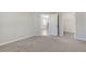 Bedroom featuring plush carpeting and adjacent walk-in closet at 5985 Amberly Dr, Bradenton, FL 34208
