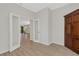 View of an open and airy room, featuring wood floors, neutral walls, and glass doors at 5985 Amberly Dr, Bradenton, FL 34208