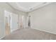 Spacious main bedroom with soft carpeting and convenient access to a walk-in closet and the bathroom at 5985 Amberly Dr, Bradenton, FL 34208