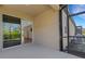 The screened lanai features access to the home's interior and a view of the backyard at 5985 Amberly Dr, Bradenton, FL 34208