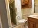 A bathroom featuring a walk-in shower and a wooden cabinet at 6074 Arlene Way # 5, Bradenton, FL 34207