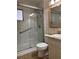 Accessible bathroom with a glass enclosed shower with safety bars at 6074 Arlene Way # 5, Bradenton, FL 34207