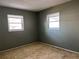Bedroom with two windows providing natural light at 6074 Arlene Way # 5, Bradenton, FL 34207