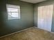 Cozy bedroom with a large window and bi-fold closet doors at 6074 Arlene Way # 5, Bradenton, FL 34207