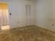 Neutral bedroom with a walk-in shower visible in en suite bathroom at 6074 Arlene Way # 5, Bradenton, FL 34207