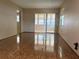 Spacious living room with glossy wood floors and natural light at 6074 Arlene Way # 5, Bradenton, FL 34207