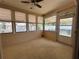 Cozy sunroom with wall-to-wall windows and outdoor access at 6074 Arlene Way # 5, Bradenton, FL 34207