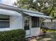 This enclosed sunroom features great natural light and is perfect for relaxing or entertaining at 6074 Arlene Way # 5, Bradenton, FL 34207