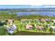 Beautiful aerial shot of waterfront homes, docks, and lush landscaping near the river at 6143 9Th Avenue Ne Cir, Bradenton, FL 34212