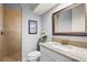 Updated bathroom with granite counters, neutral tile shower and bronze fixtures at 6143 9Th Avenue Ne Cir, Bradenton, FL 34212