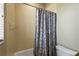 Tiled bathtub/shower combination with a shower curtain at 6143 9Th Avenue Ne Cir, Bradenton, FL 34212