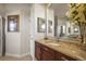 A charming bathroom with granite counters and dark wood cabinets at 6143 9Th Avenue Ne Cir, Bradenton, FL 34212