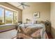 Cozy bedroom featuring a bay window with a seating area and a ceiling fan at 6143 9Th Avenue Ne Cir, Bradenton, FL 34212
