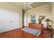Bedroom features wood floors and a double-door closet at 6143 9Th Avenue Ne Cir, Bradenton, FL 34212