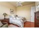 Bright bedroom with a ceiling fan, wood floors, and charming decor at 6143 9Th Avenue Ne Cir, Bradenton, FL 34212