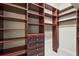 The walk-in closet features custom wood shelving and ample space at 6143 9Th Avenue Ne Cir, Bradenton, FL 34212