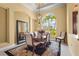 Elegant dining room with a chandelier and large window, perfect for formal gatherings at 6143 9Th Avenue Ne Cir, Bradenton, FL 34212