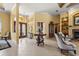 Bright foyer with tile floors, elegant furnishings, and a decorative entry door at 6143 9Th Avenue Ne Cir, Bradenton, FL 34212