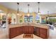 Open kitchen area with wraparound granite counter, sink and stainless steel dishwasher appliance at 6143 9Th Avenue Ne Cir, Bradenton, FL 34212