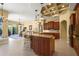 Gourmet kitchen with granite countertops and island, open to the living area for seamless entertaining at 6143 9Th Avenue Ne Cir, Bradenton, FL 34212